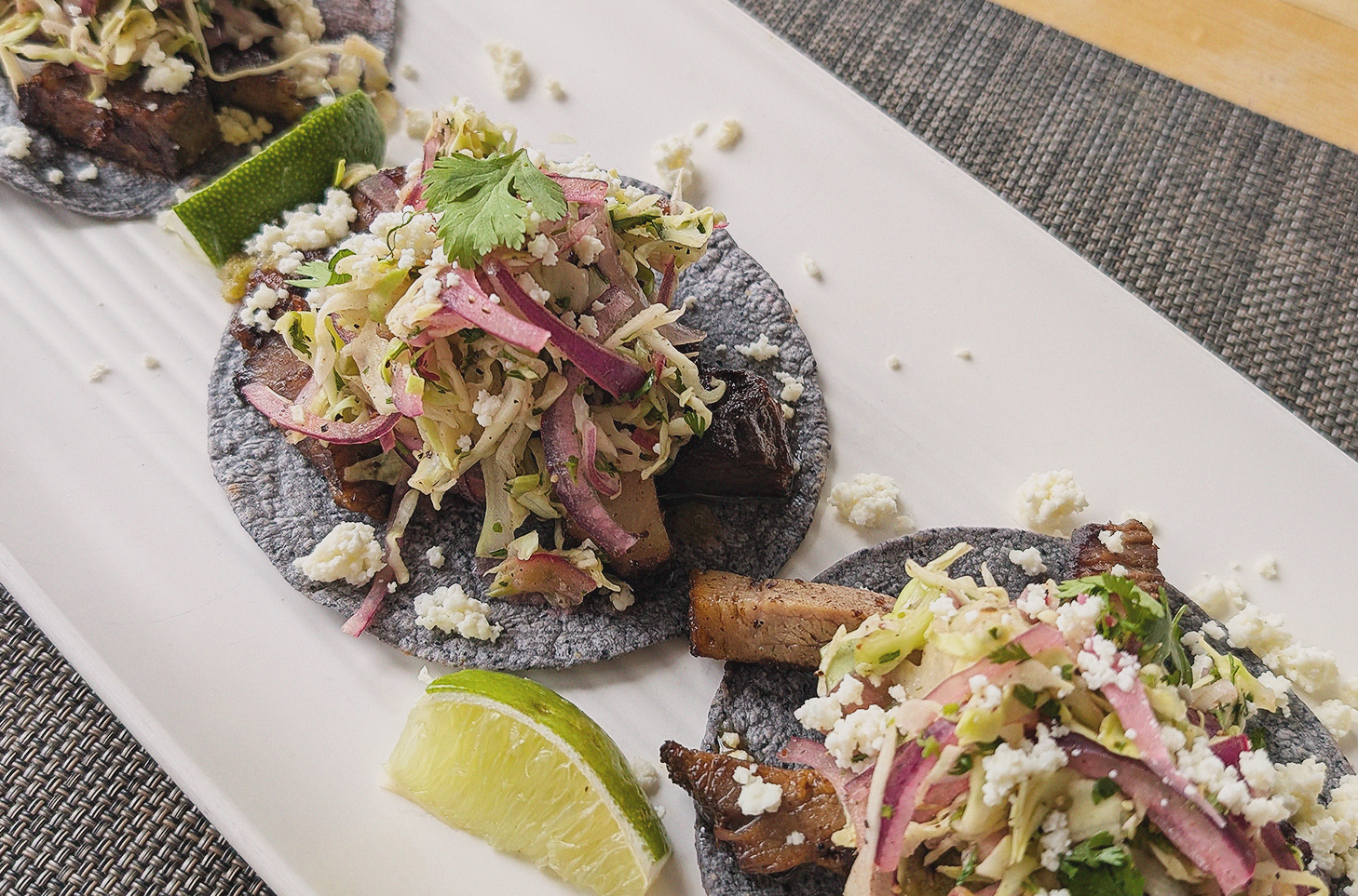 brunch carnitas tacos on white ceramic plate