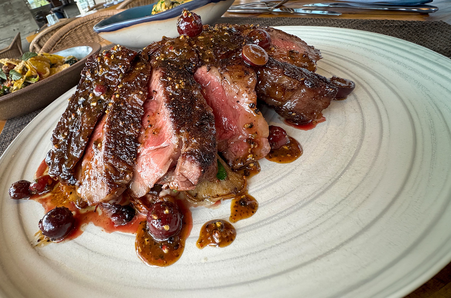 ribeye steak on white dinner plate