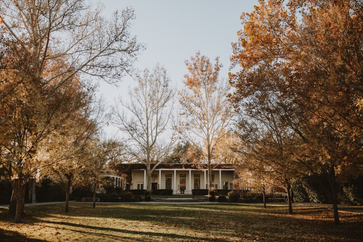 fall foliage in front of la quinta by Blue Rose Photography