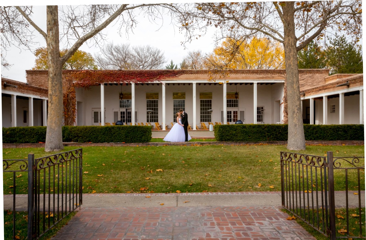 Bride and Groom in front of La Quinta in the Fall