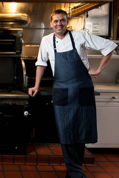 chef brand standing in the kitchen